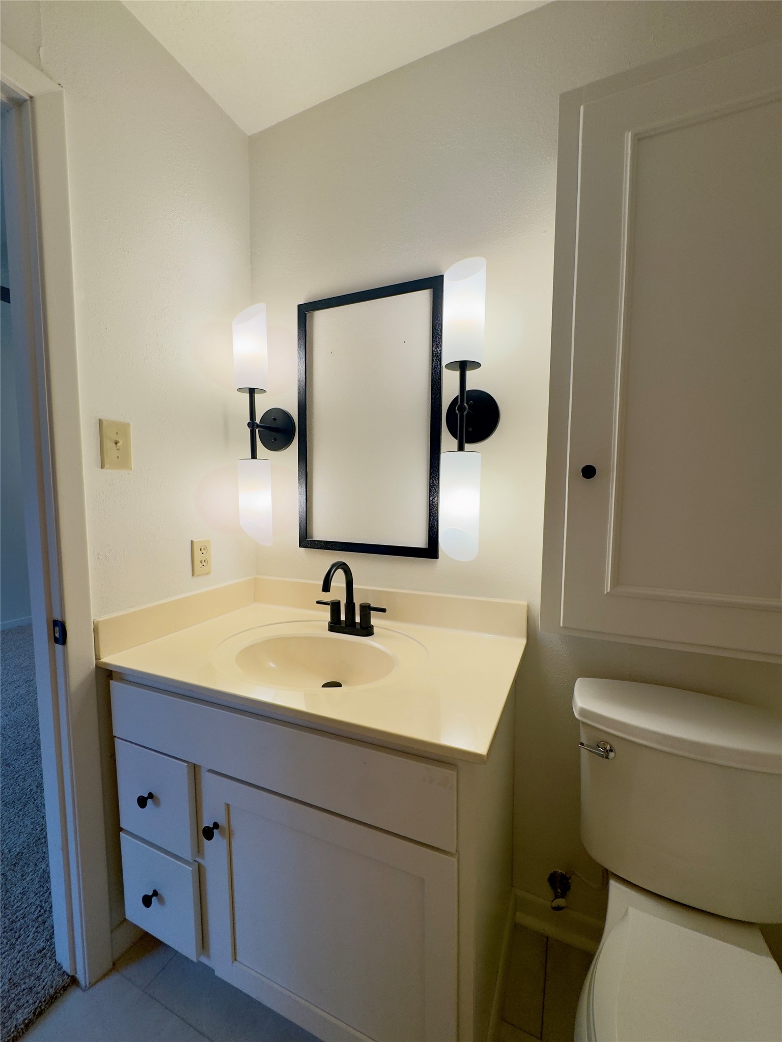 24231 Shellbrook Drive Houston, TX 77336 - Photo 21 of 42 a bathroom with a toilet sink and mirror