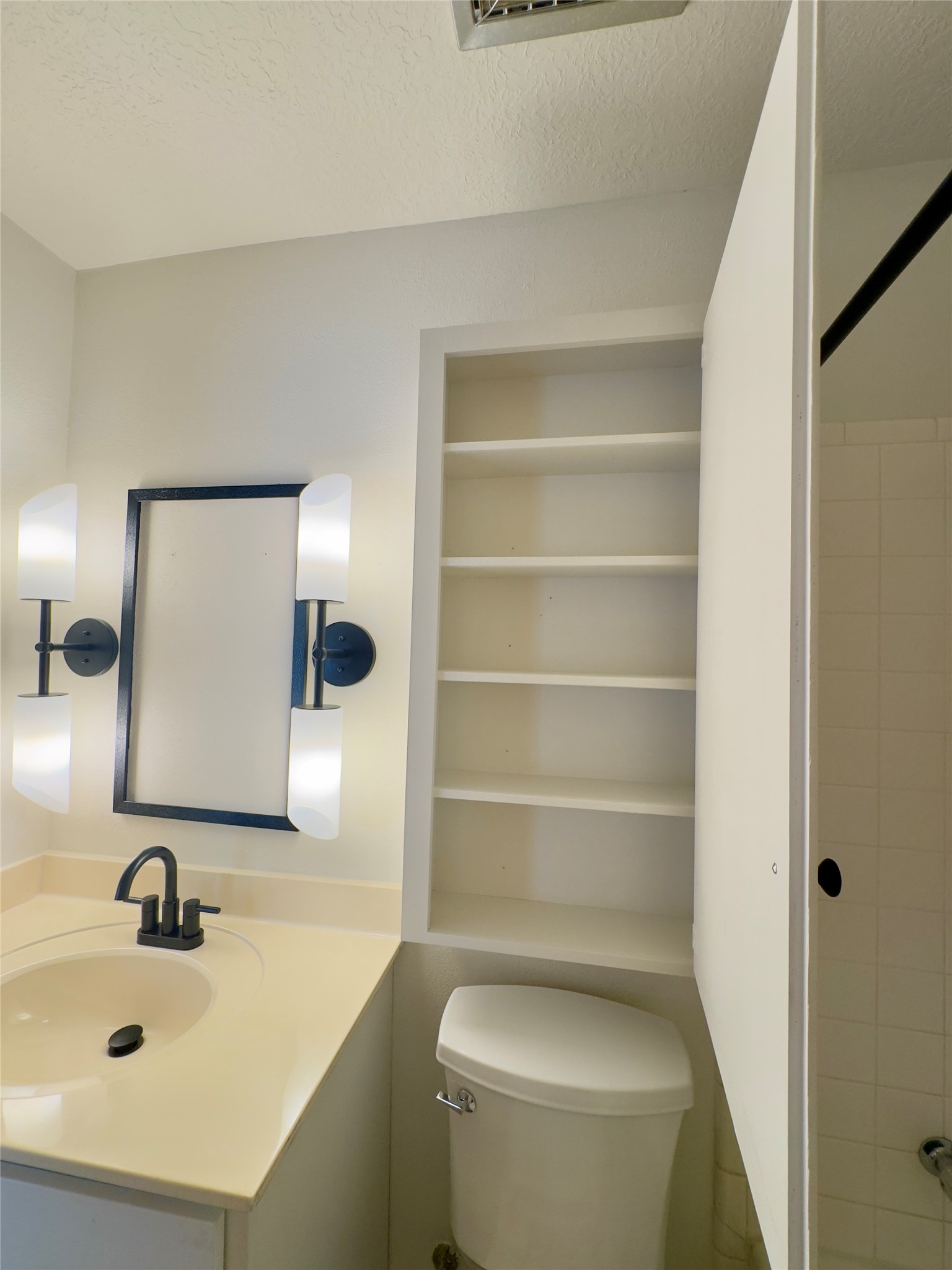 24231 Shellbrook Drive Houston, TX 77336 - Photo 22 of 42 a bathroom with a sink a toilet and a mirror