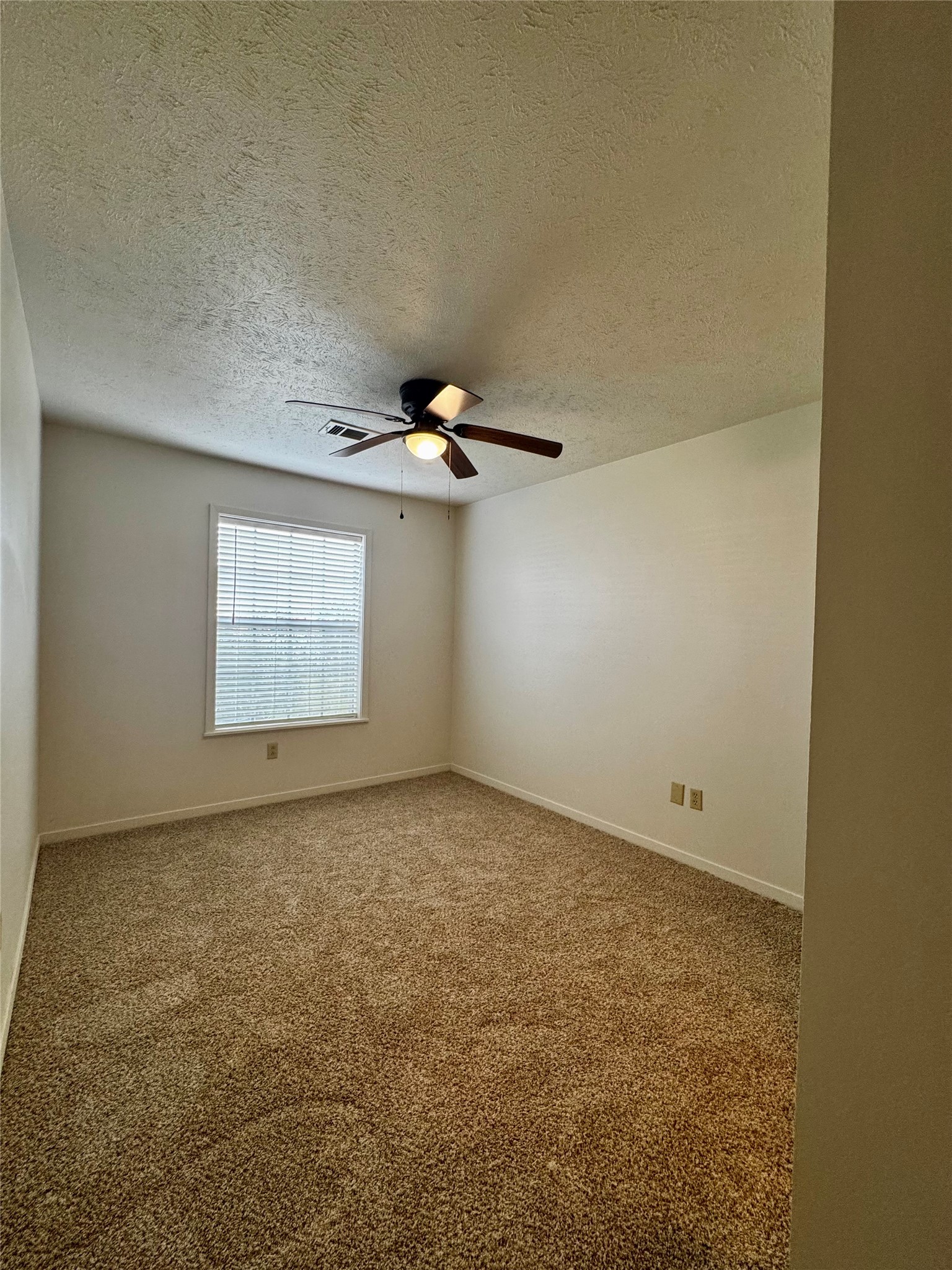 24231 Shellbrook Drive Houston, TX 77336 - Photo 24 of 42 an empty room with windows