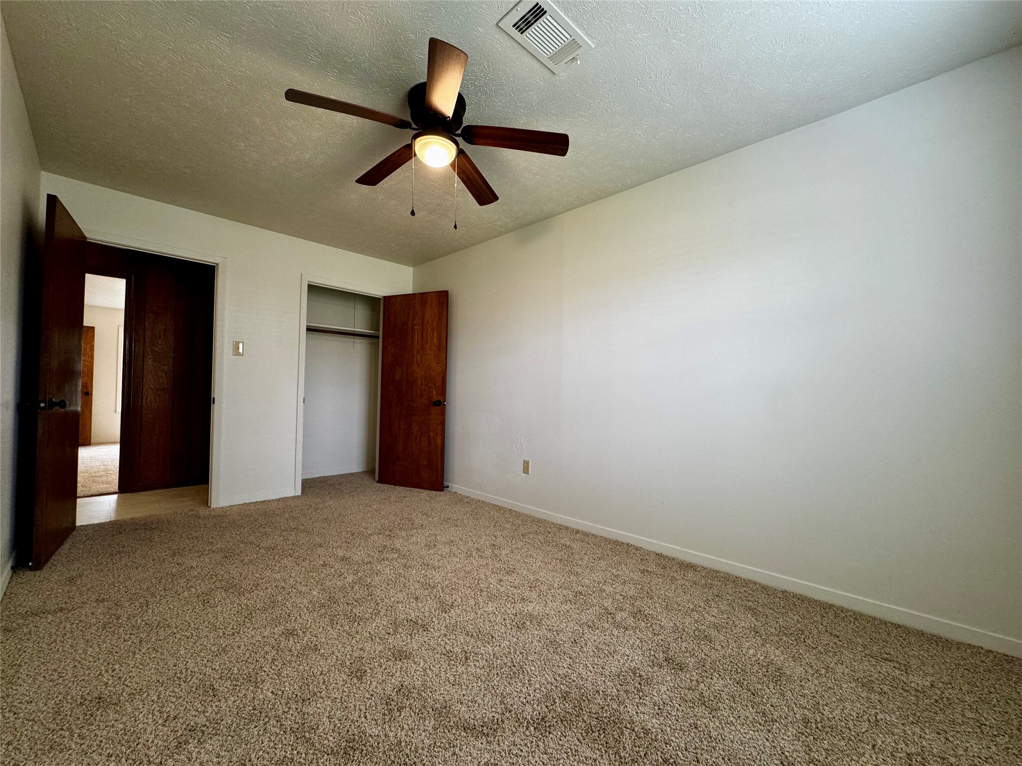 24231 Shellbrook Drive Houston, TX 77336 - Photo 26 of 42 an empty room with ceiling fan and window