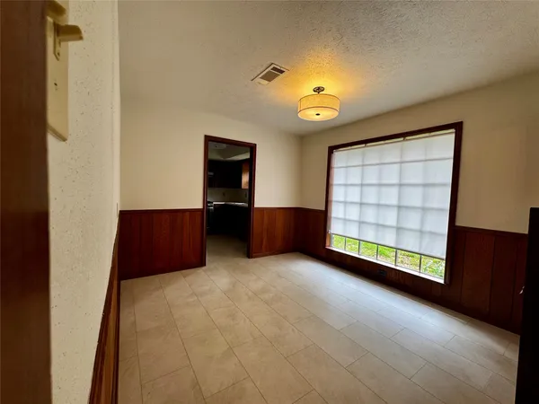 a kitchen with granite countertop a stove cabinets and microwave