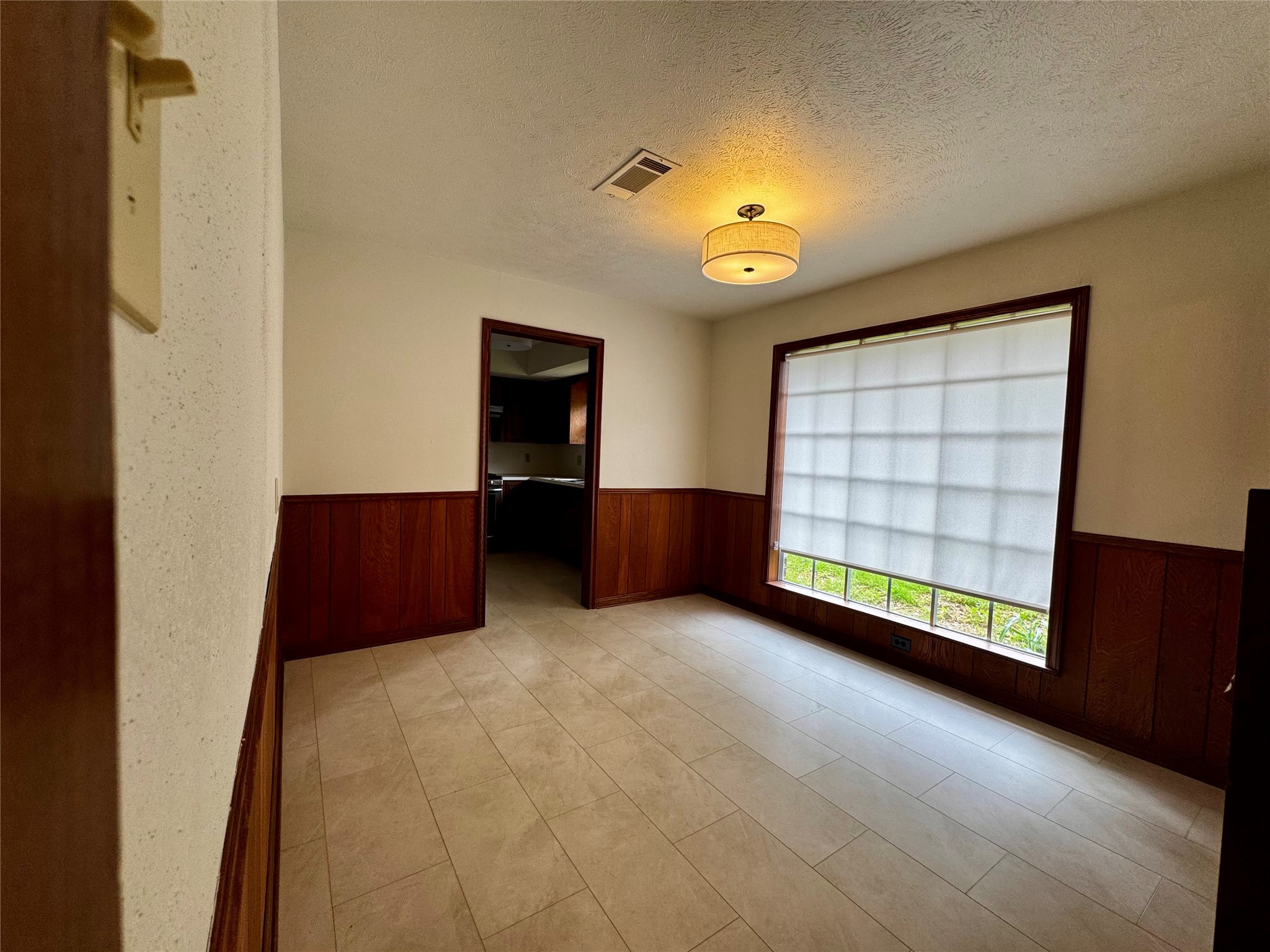 24231 Shellbrook Drive Houston, TX 77336 - Photo 8 of 42 an empty room with windows and cabinet