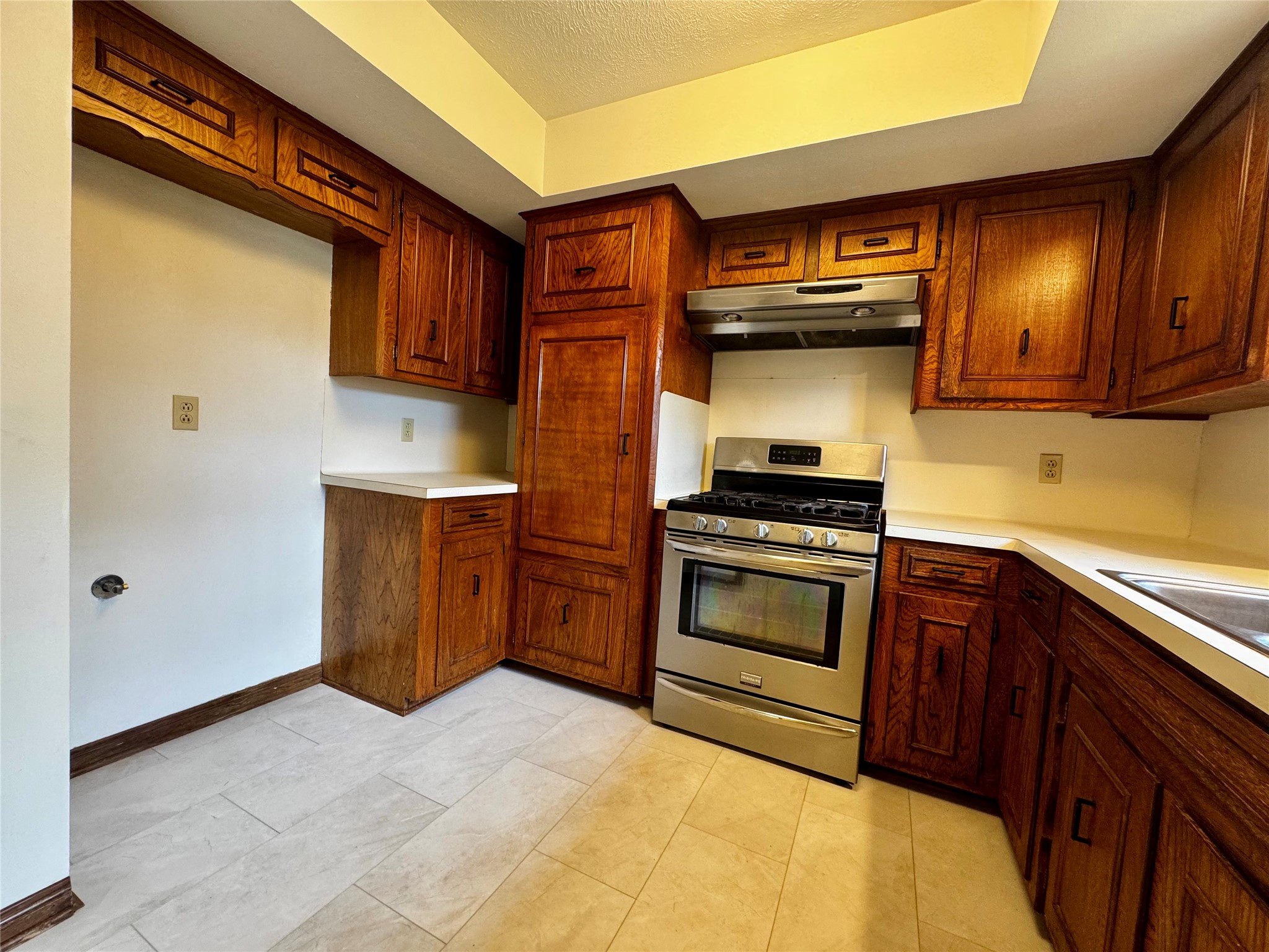 24231 Shellbrook Drive Houston, TX 77336 - Photo 10 of 42 a kitchen with stainless steel appliances granite countertop a stove a sink and a microwave