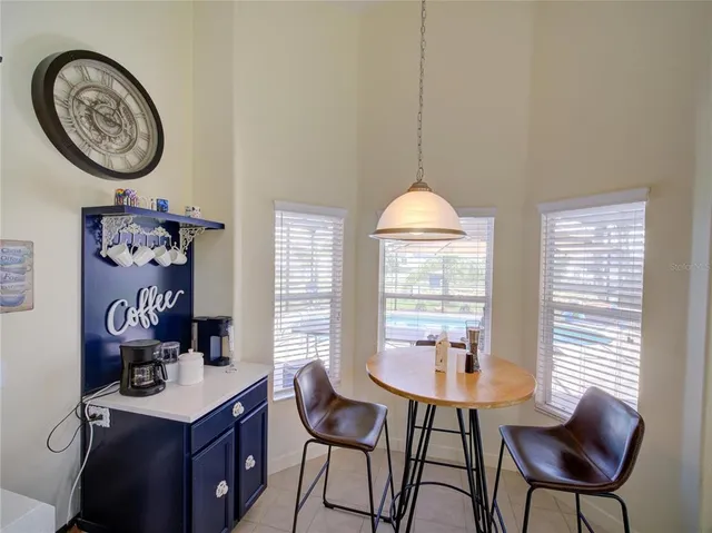 a view of a room with furniture and a window