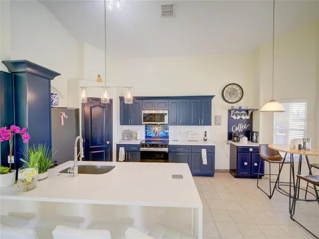 a large kitchen with cabinets and furniture