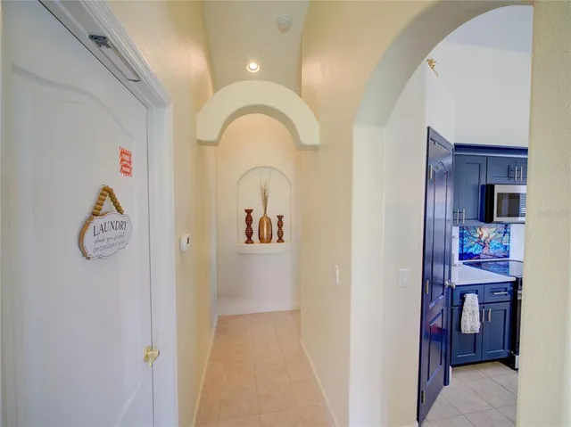 a bedroom with a bed window and a chair