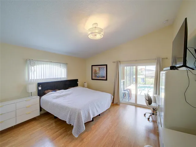 a bedroom with a bed and a desk