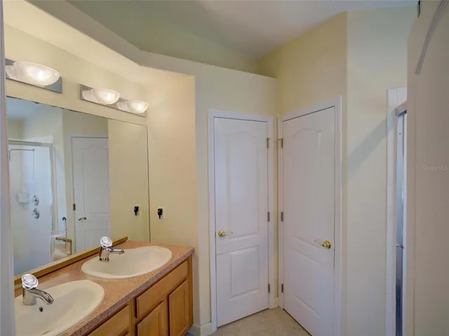 a bathroom with a shower and a door