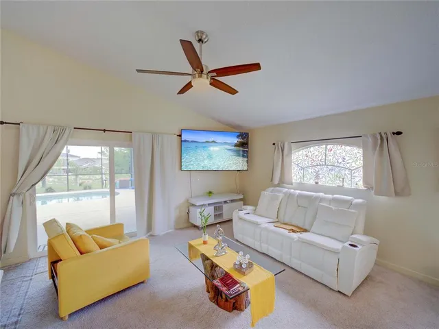 a view of a green field with a swimming pool