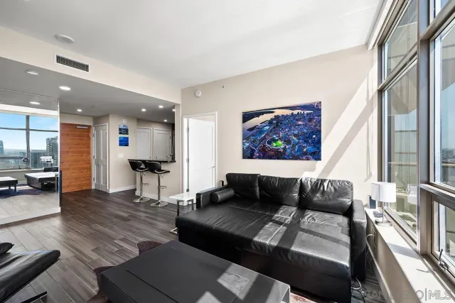 a living room with furniture and a large window