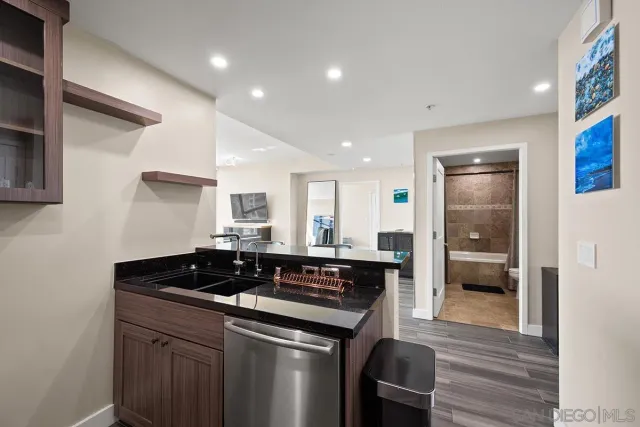 a kitchen with a sink and cabinets