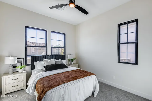 a bedroom with a bed and a shower