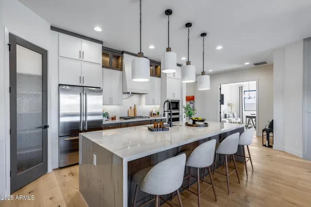 a dining room with furniture window and wooden floor