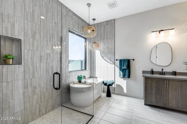 a view of a backyard with a garden and entertaining space