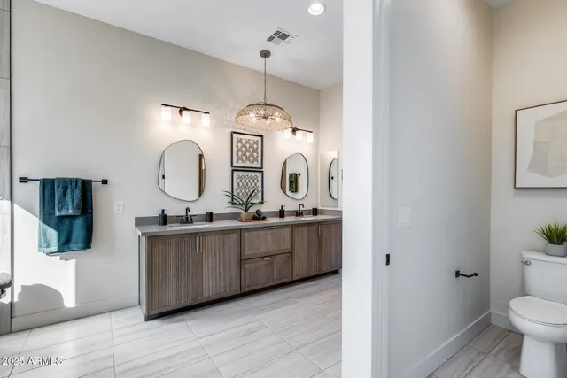 a view of a patio with a table and chairs under an umbrella