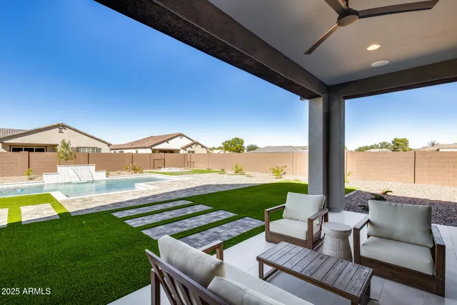 a house with swimming pool in front of it