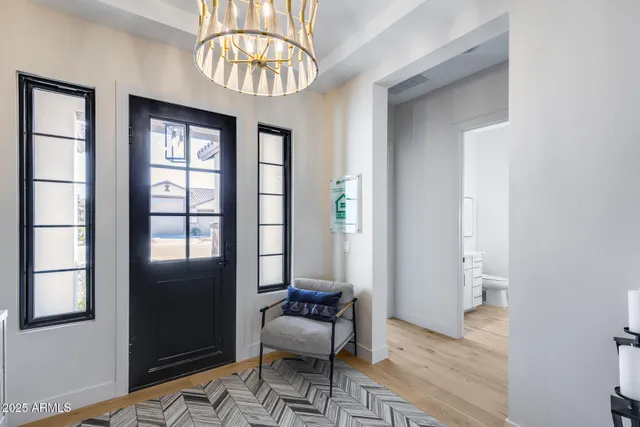 a view of hall way with furniture and entry way