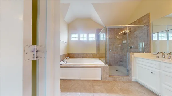 a bathroom with a granite countertop sink a toilet and shower