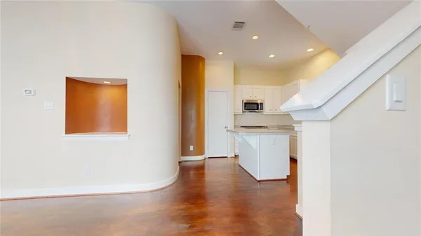 a view of a kitchen with a sink dishwasher and a microwave