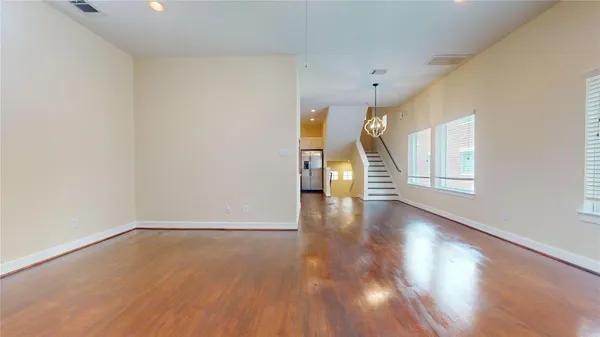 a view of an entryway with wooden floor