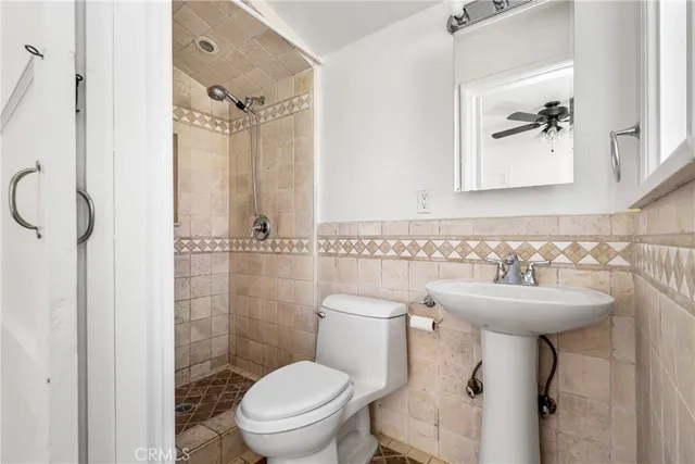 a view of a pathway with a house in the background