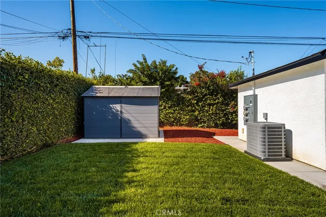 a view of kitchen with refrigerator microwave and stove top oven