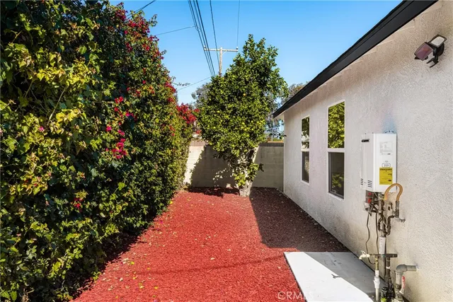 a kitchen with cabinets stainless steel appliances and wooden floor