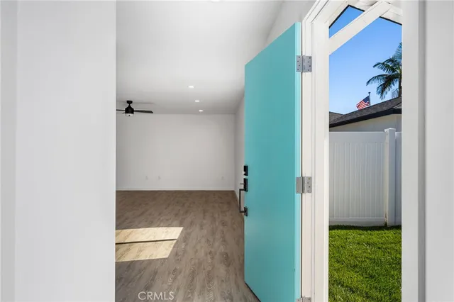 a view of kitchen with refrigerator microwave and stove top oven
