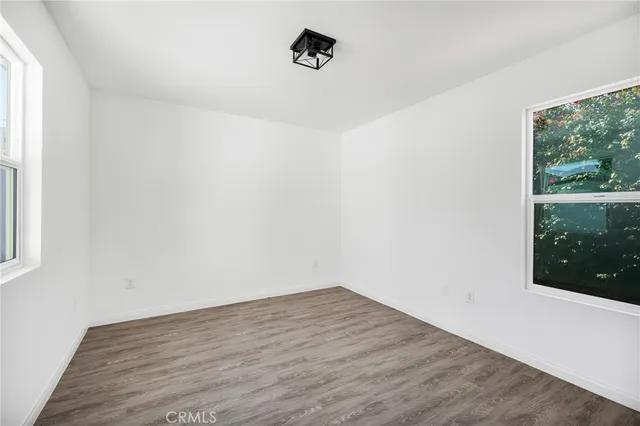 a living room with furniture and a ceiling fan