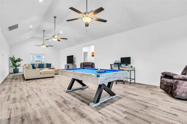 a living room with furniture and a table