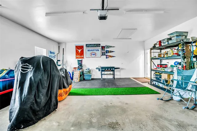 a living room with baby crib furniture and a rug