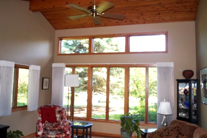 11837 Bend River Road Roscoe, IL 61073 - Photo 12 of 18 a living room with furniture and a large window