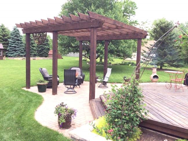 11837 Bend River Road Roscoe, IL 61073 - Photo 3 of 18 a view of a patio with chairs and a small yard
