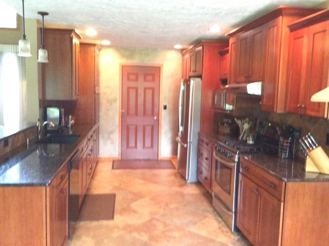 11837 Bend River Road Roscoe, IL 61073 - Photo 7 of 18 a kitchen with stainless steel appliances granite countertop a sink and a refrigerator