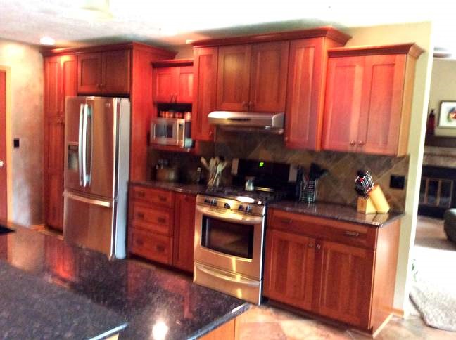 11837 Bend River Road Roscoe, IL 61073 - Photo 8 of 18 a kitchen with granite countertop wooden cabinets and stainless steel appliances