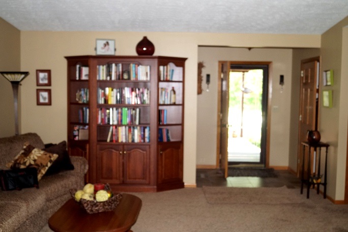 11837 Bend River Road Roscoe, IL 61073 - Photo 10 of 18 a living room with furniture and a window