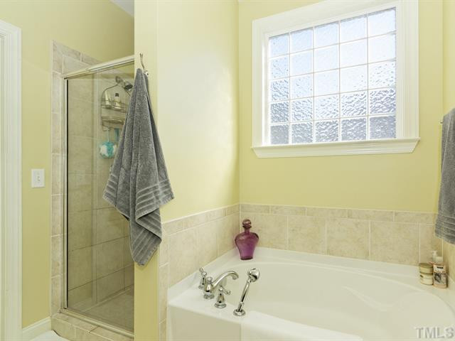 13006 Edsel Drive Raleigh, NC 27613 - Photo 14 of 25 Separate shower and soaking tub.