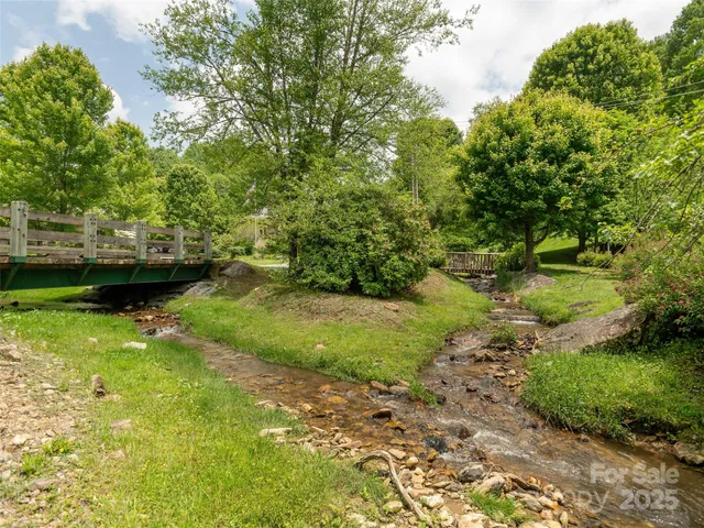 a view of a lake with a yard