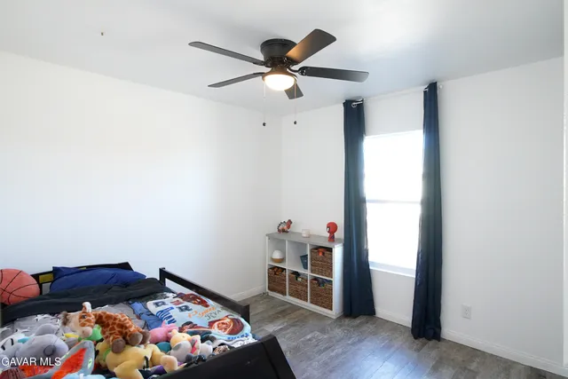 a bedroom with bed and closet