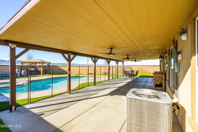a bathroom with a sink and glass door