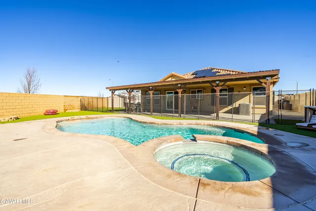 a view of a house with swimming pool