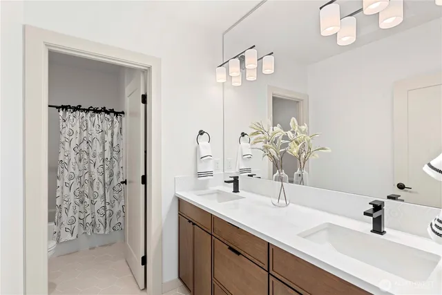 a bathroom with a sink vanity and a mirror