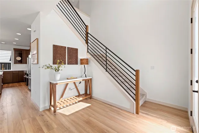 a view of an entryway with wooden floor