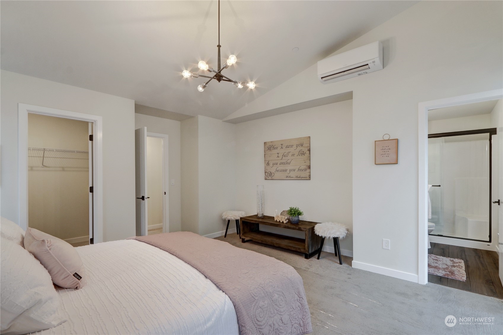 13710 Ash Way, Unit A7 Everett, WA 98204 - Photo 13 of 22 a bedroom with bed and a chandelier