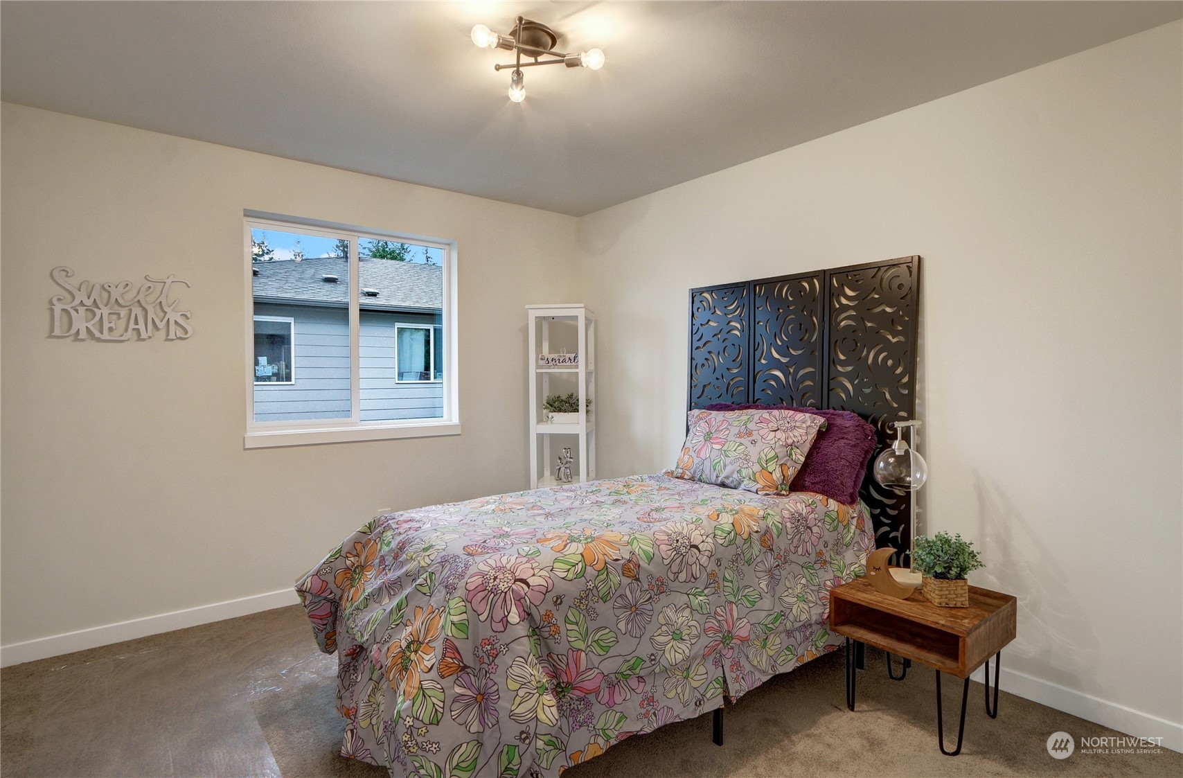 13710 Ash Way, Unit A7 Everett, WA 98204 - Photo 15 of 22 a bedroom with a bed and lamp