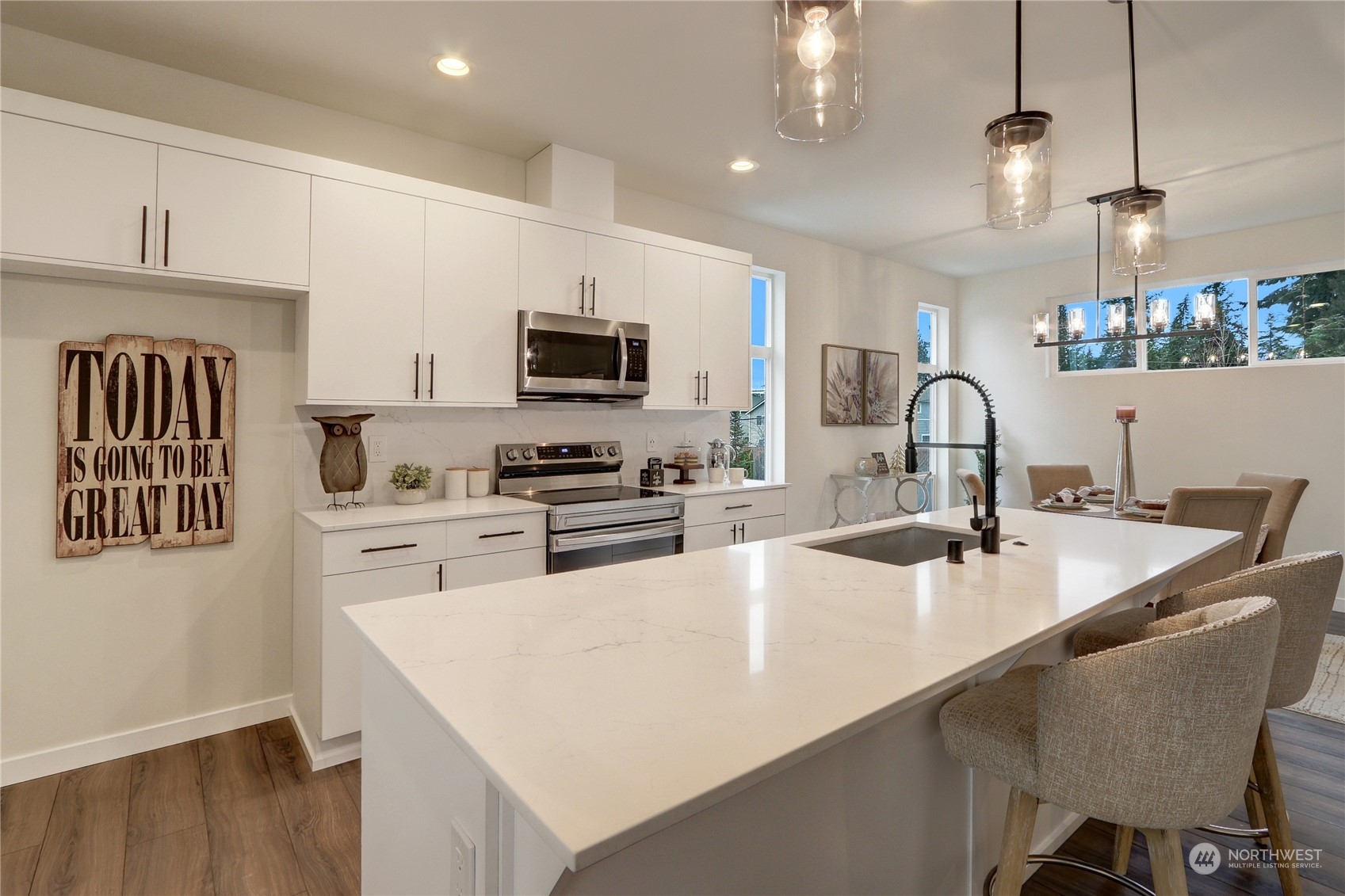 13710 Ash Way, Unit A7 Everett, WA 98204 - Photo 6 of 22 a kitchen with kitchen island a sink stove and refrigerator