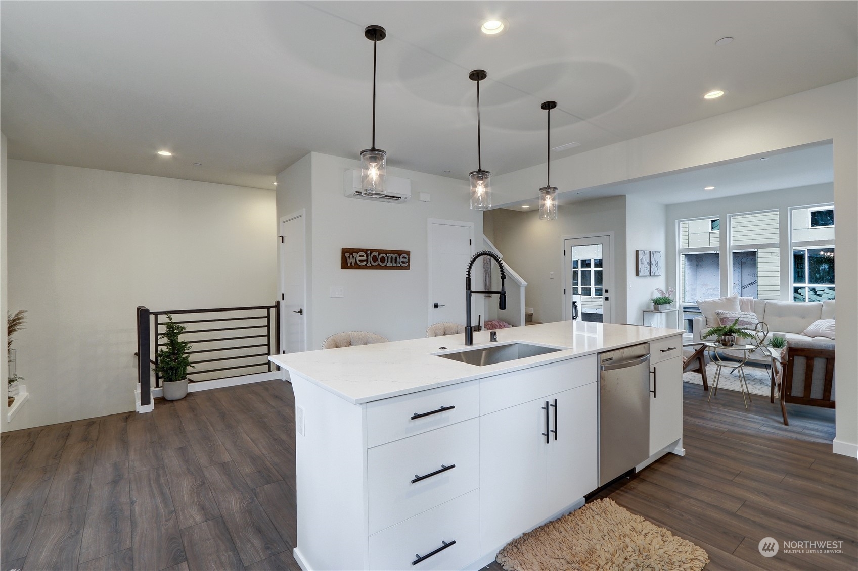 13710 Ash Way, Unit A7 Everett, WA 98204 - Photo 7 of 22 a kitchen with stainless steel appliances granite countertop a sink a stove a refrigerator and island with wooden floor