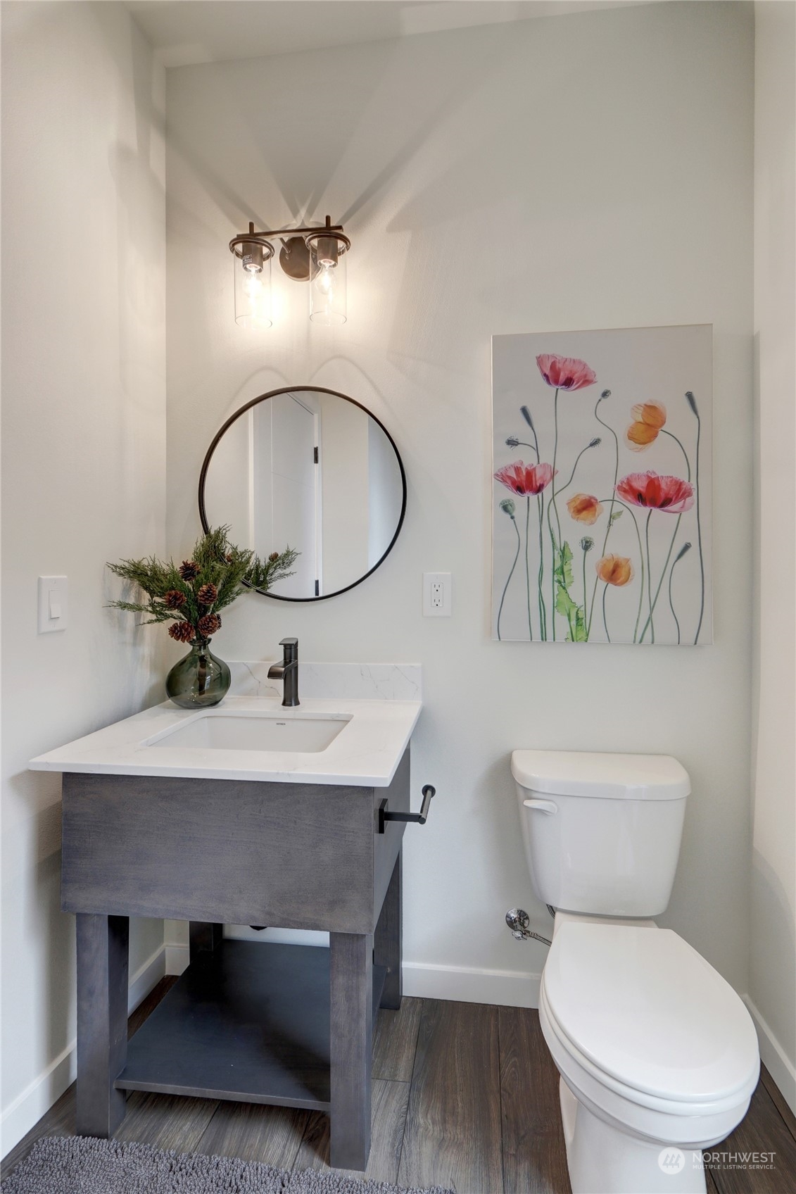 13710 Ash Way, Unit A7 Everett, WA 98204 - Photo 10 of 22 a bathroom with a toilet a sink and a mirror