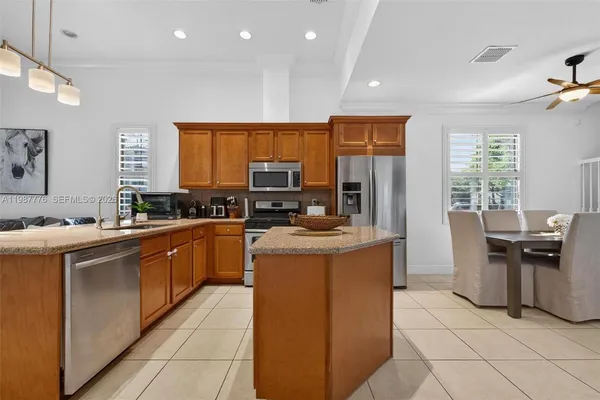 a kitchen with sink cabinets and window