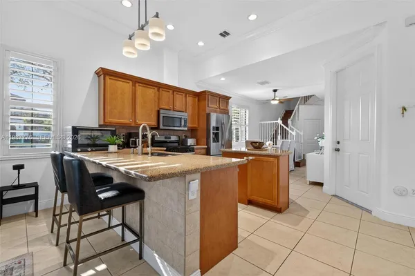 a kitchen with a table and chairs